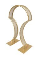 The 4 Pack Bridge Style Tabletop Centerpiece features a matte gold finish, stands 31½" tall, and showcases a modern sculptural arch with curved, perforated sides on rectangular bases—the design mirrors two stylized question marks.