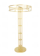 The Floral Riser Tabletop Centerpiece, standing 4ft tall in a gold finish, features a round base and an open circular frame supported by a striking geometric grid-like column—making it an elegant choice for showcasing floral arrangements in style.