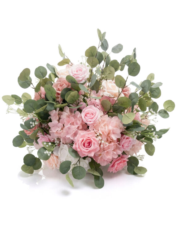 A bouquet of pink and blush roses, hydrangeas, and green eucalyptus leaves arranged in a loose, natural style forms a charming flower ball centerpiece against a white background.