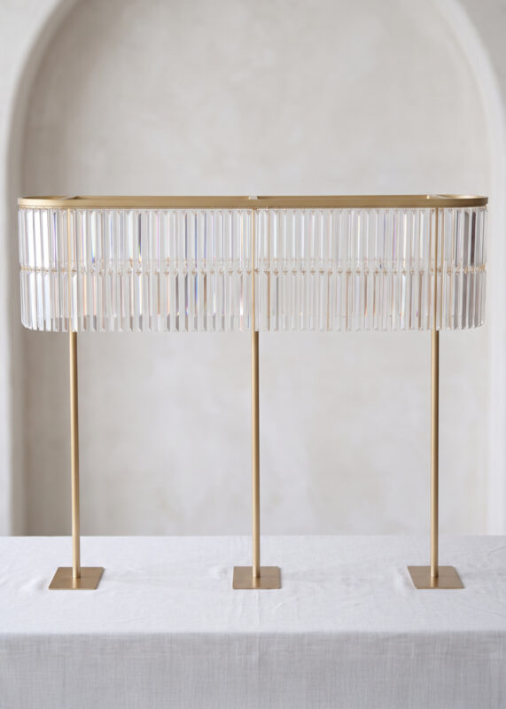 Gold Double-Layer Crystal Fringe Wedding Centerpiece Stand, Glamorous & Radiant 51.2in Tall Oval Design featuring two layers of hanging prisms supported by three thin gold poles on square bases.