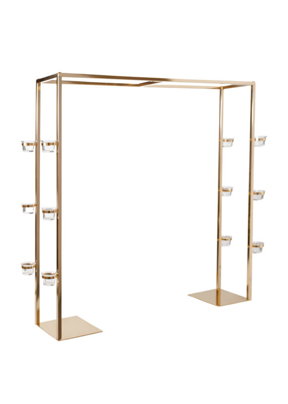 Gold-tone rectangular metal arch centerpiece stand with six small glass candle holders attached to the vertical frame.
